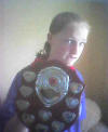 Katie, holding her football club's "Individual Player" shield, awarded for their 2003/4 season