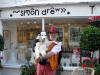 Simon Drew & his dog [of 'Simon Drew cards' fame] taken outside his shop in Dartmouth - friday