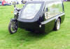 motor bike with its side car converted into a herse!! Why??